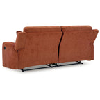 87" Manual Reclining Sofa - Spice Orange Polyester, Tufted Back, Zero Wall Design, 2 Pillows